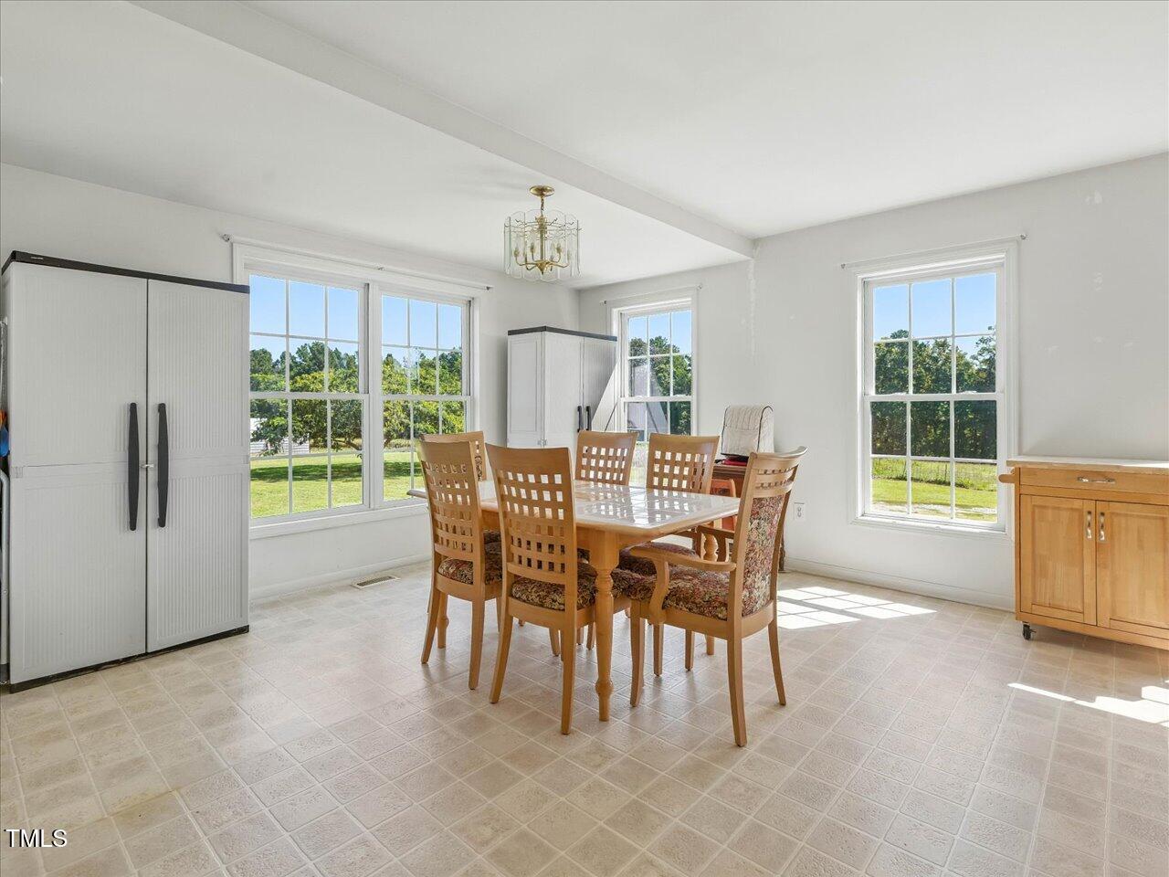 2892 Silk Hope Liberty Road Siler City, NC 27344 - Photo 14 of 74 a dining room with furniture and window