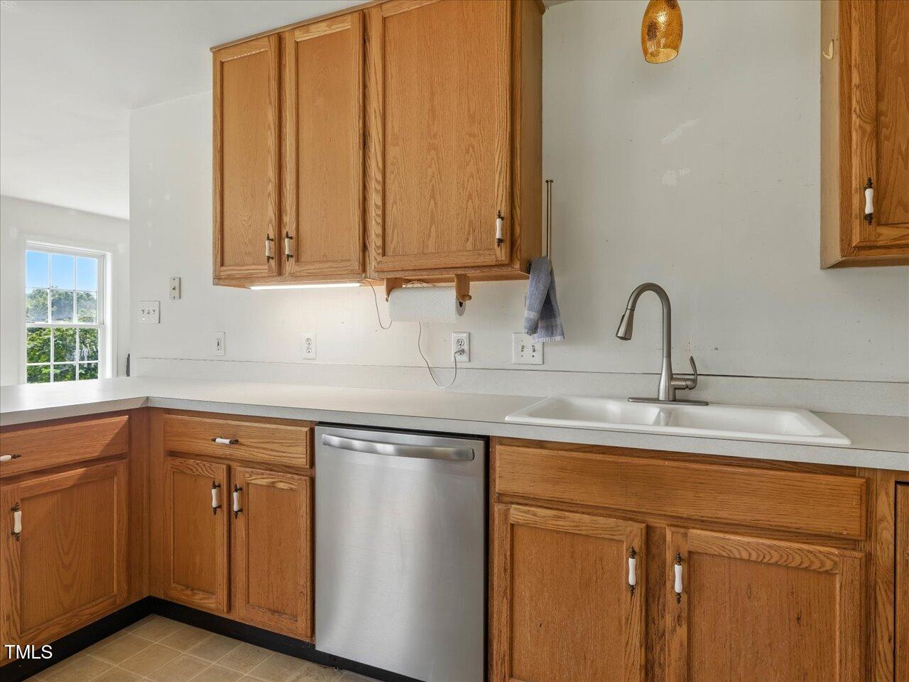2892 Silk Hope Liberty Road Siler City, NC 27344 - Photo 18 of 74 a kitchen with cabinets and white appliances