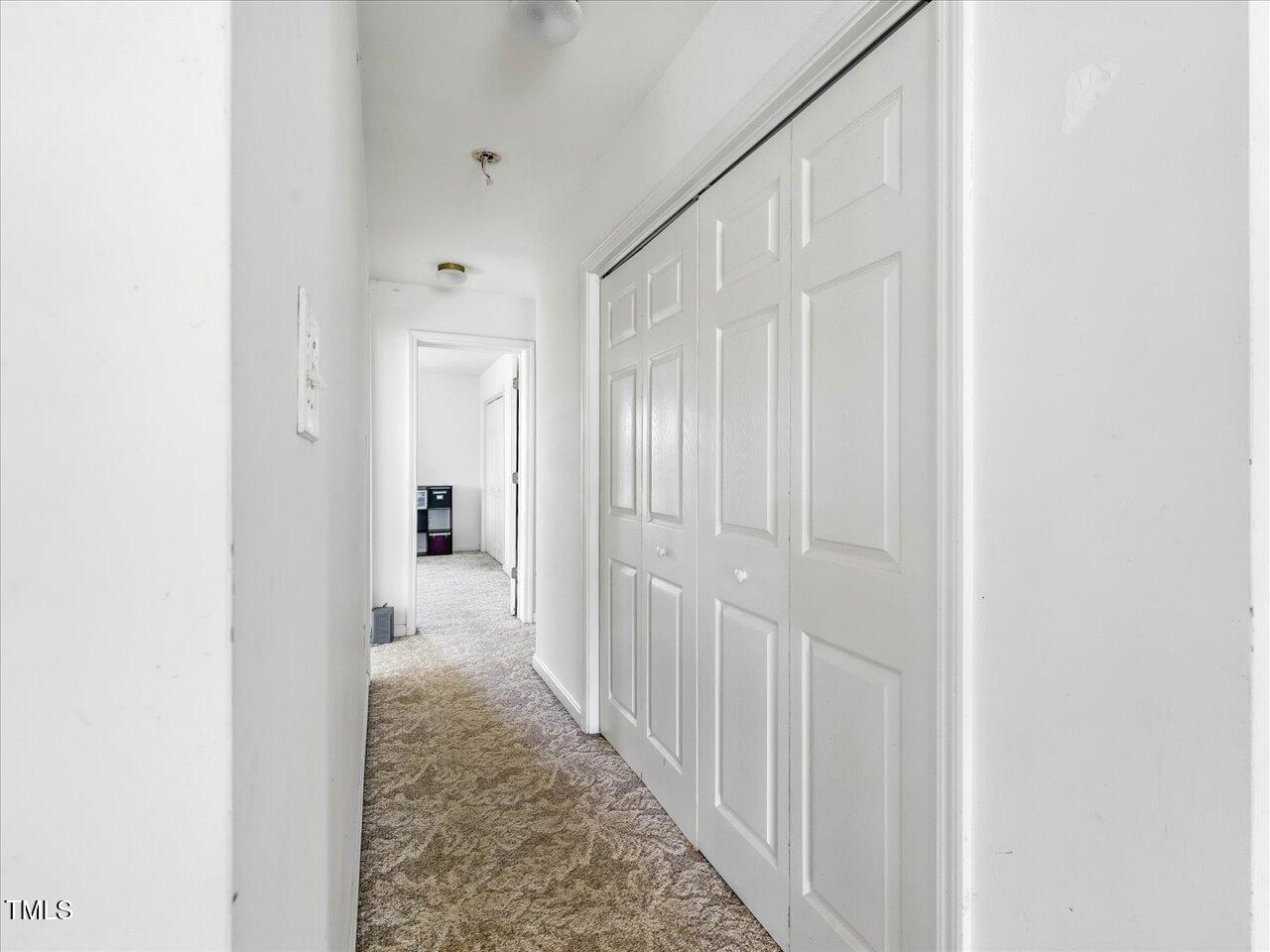 2892 Silk Hope Liberty Road Siler City, NC 27344 - Photo 21 of 74 a view of a hallway with a wooden shelves