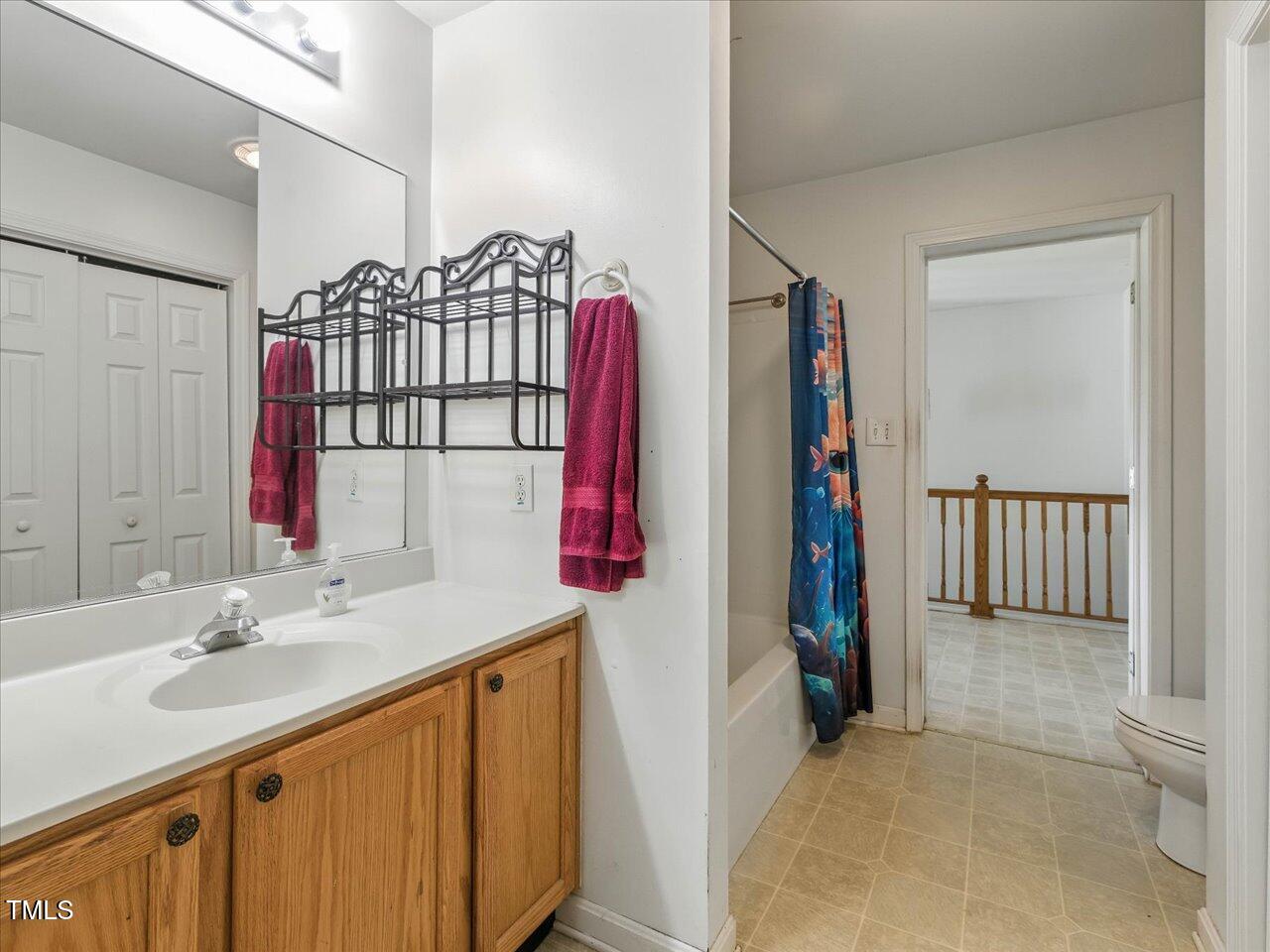 2892 Silk Hope Liberty Road Siler City, NC 27344 - Photo 23 of 74 a bathroom with a sink vanity and a mirror