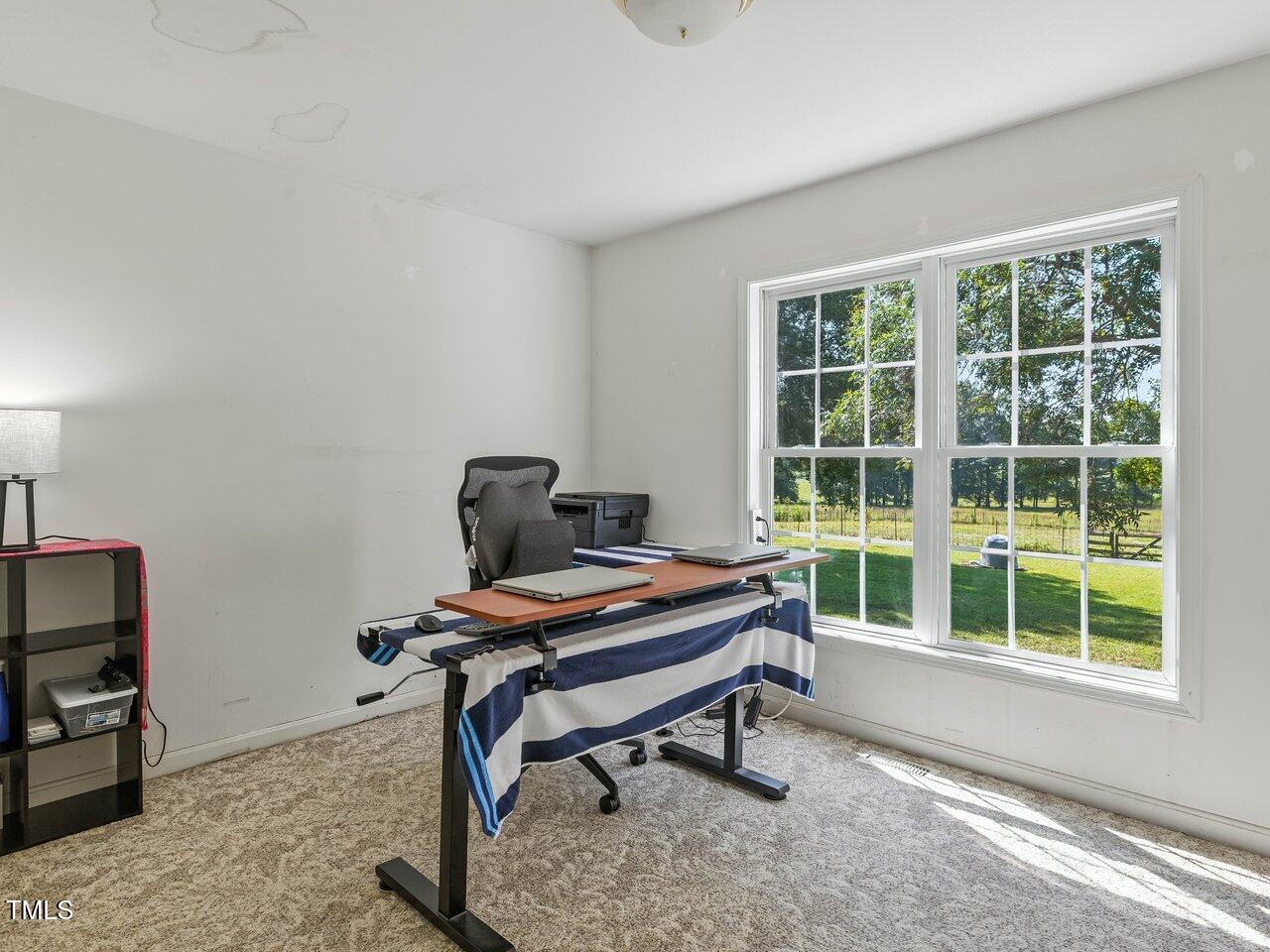 2892 Silk Hope Liberty Road Siler City, NC 27344 - Photo 28 of 74 a workspace with furniture and a window