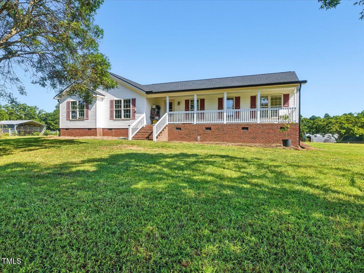2892 Silk Hope Liberty Road Siler City, NC 27344 - Photo 2 of 74 a front view of house with yard and green space
