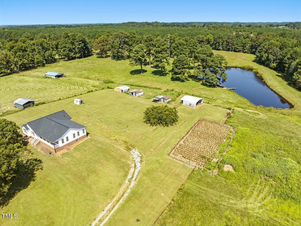 2892 Silk Hope Liberty Road Siler City, NC 27344 - Photo 41 of 74 a view of a swimming pool with a lake
