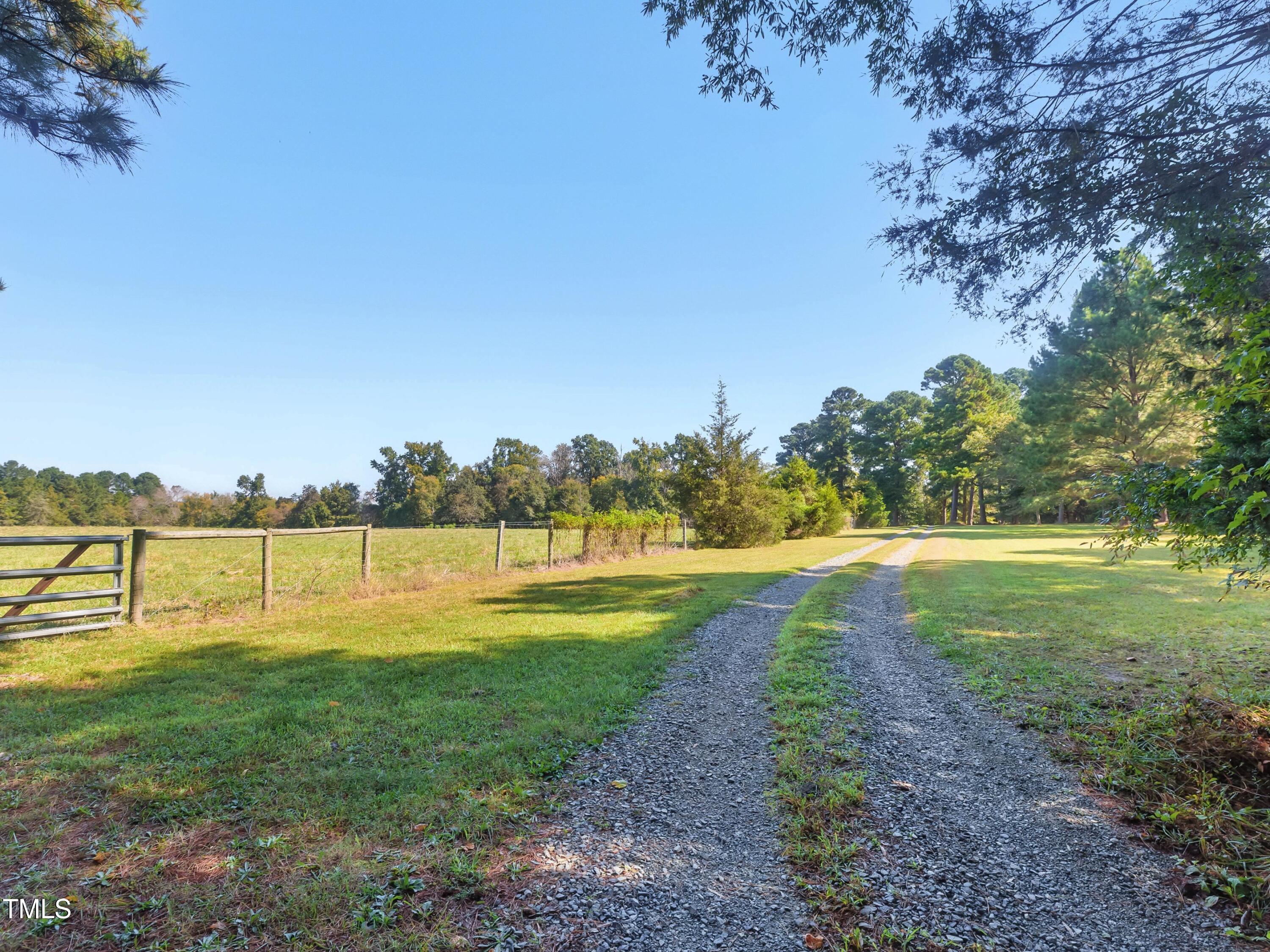 2892 Silk Hope Liberty Road Siler City, NC 27344 - Photo 54 of 74 a view of a lake with houses in the back
