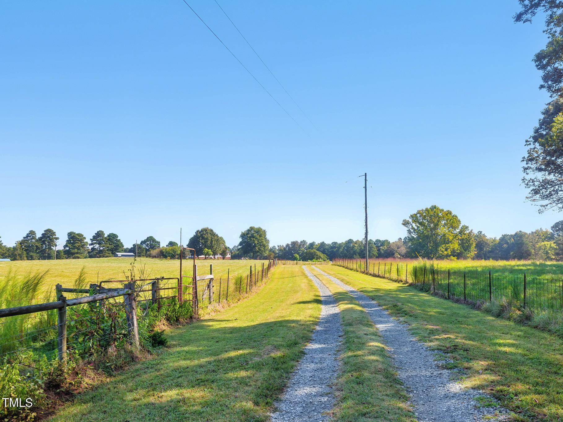 2892 Silk Hope Liberty Road Siler City, NC 27344 - Photo 56 of 74 a view of a lake with houses in the background