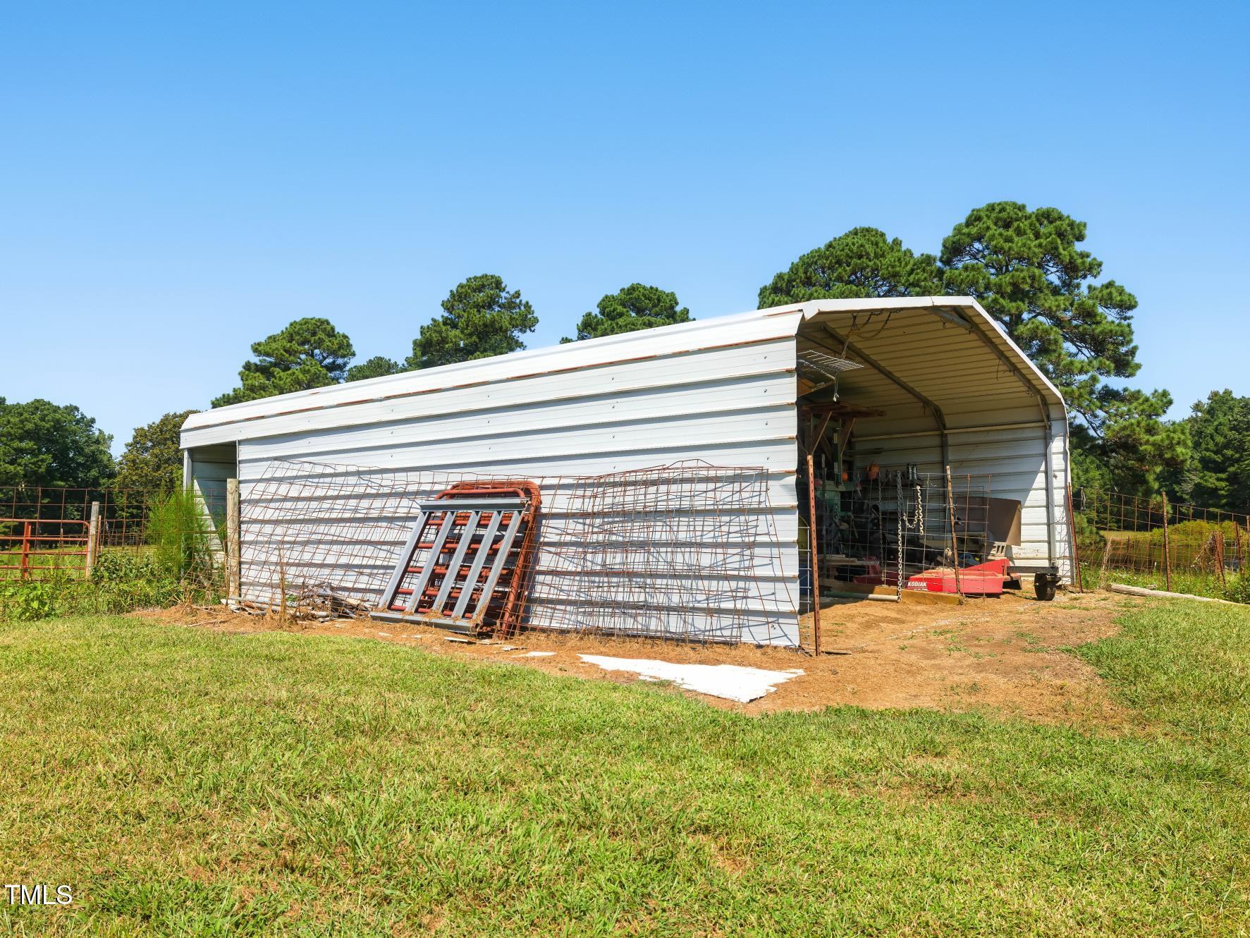 2892 Silk Hope Liberty Road Siler City, NC 27344 - Photo 61 of 74 a view of a house with a yard and sitting area