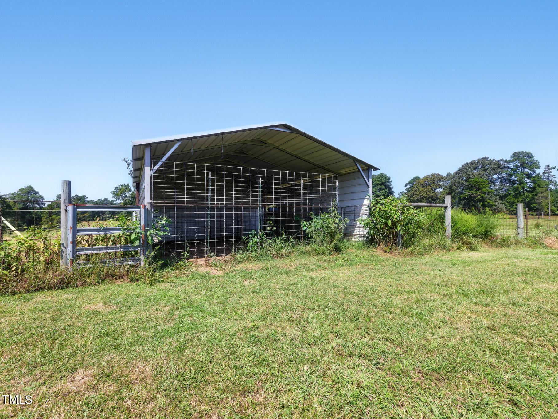 2892 Silk Hope Liberty Road Siler City, NC 27344 - Photo 69 of 74 a front view of a house with garden
