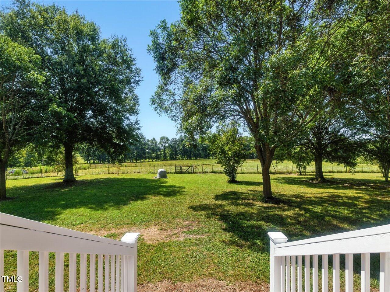 2892 Silk Hope Liberty Road Siler City, NC 27344 - Photo 6 of 74 a view of a golf course with a lake