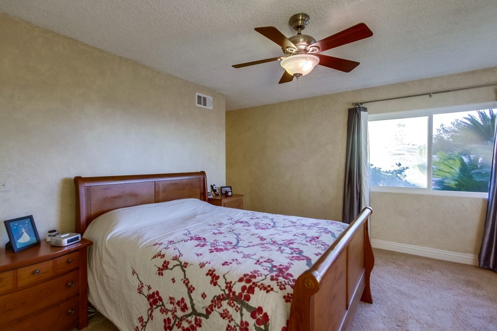 2322 Windmill View Road El Cajon, CA 92020 - Photo 18 of 25 Master bedroom is full of light plus big walk in closet!