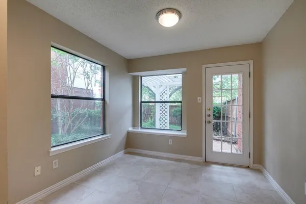 a view of a kitchen with kitchen island wooden floor and window