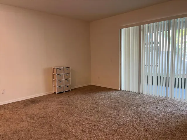 a view of a room that has a large window