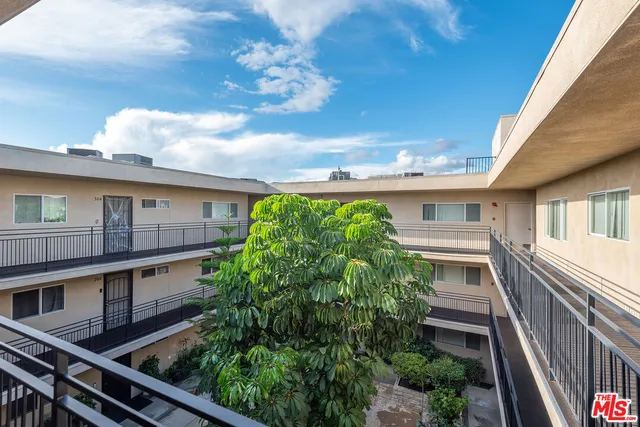 a view of a house with brick walls