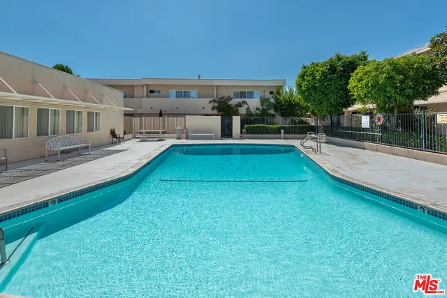 a view of a swimming pool with a patio
