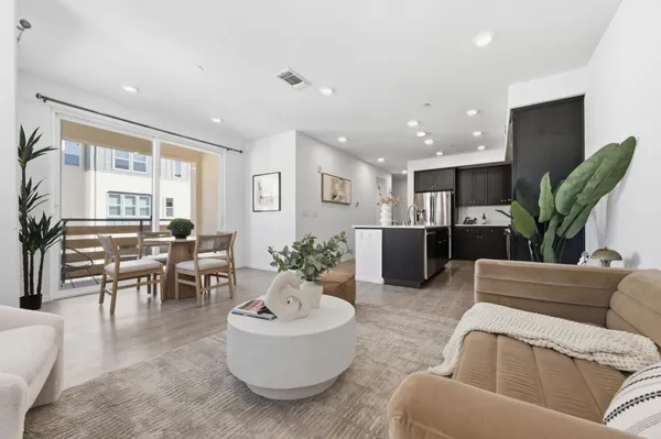 a living room with furniture and a table
