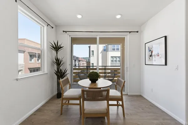 a dining room with furniture and window