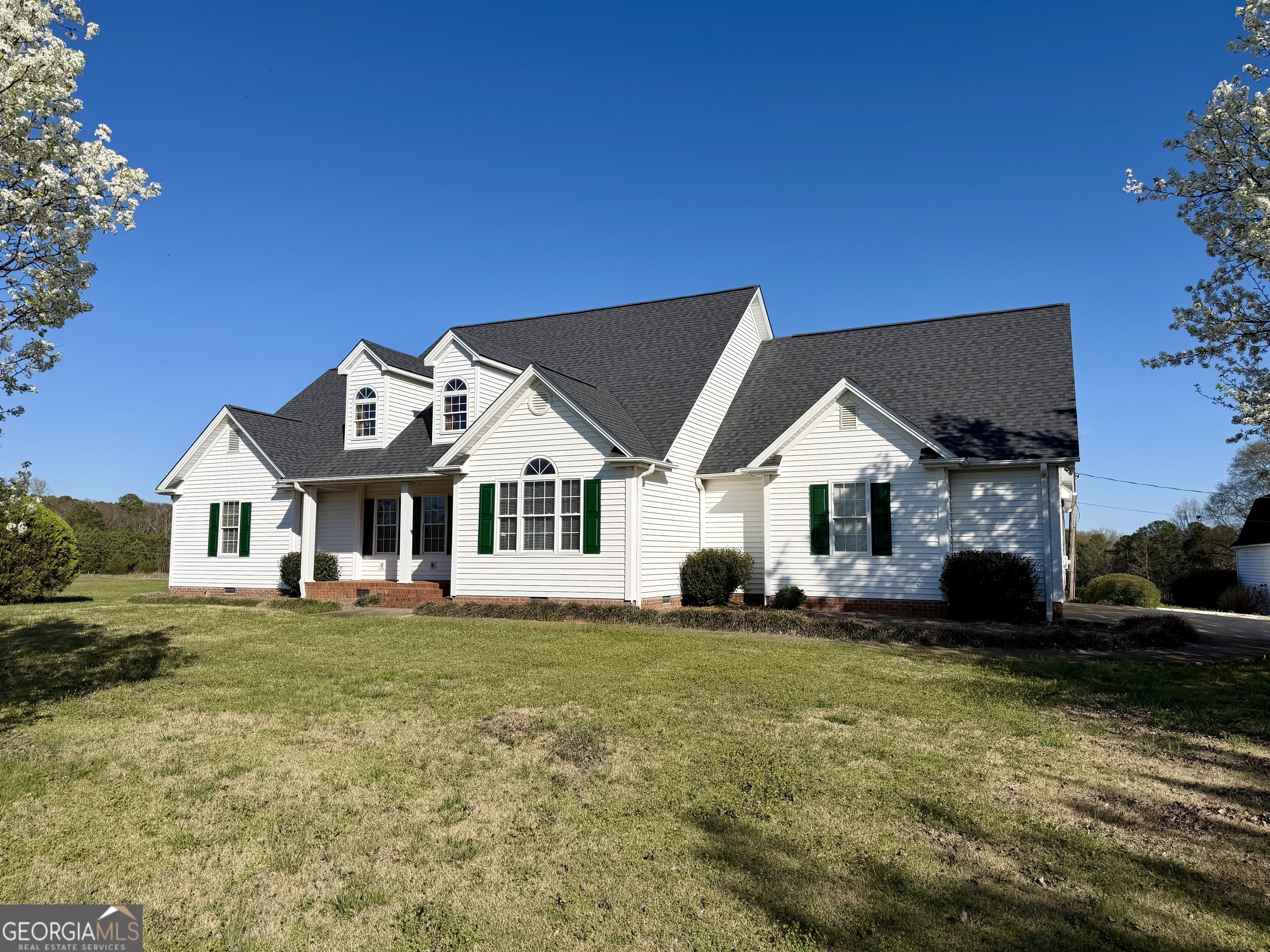 494 Broad Street Bowman, GA 30624 - Photo 3 of 65 a front view of a house with a yard