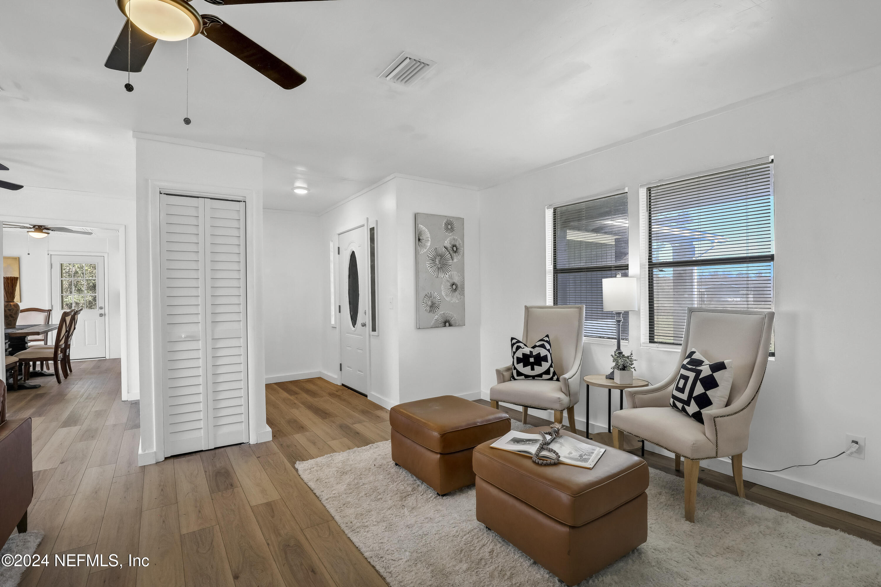 54221 Cravey Road Callahan, FL 32011 - Photo 14 of 52 a living room with furniture and a wooden floor