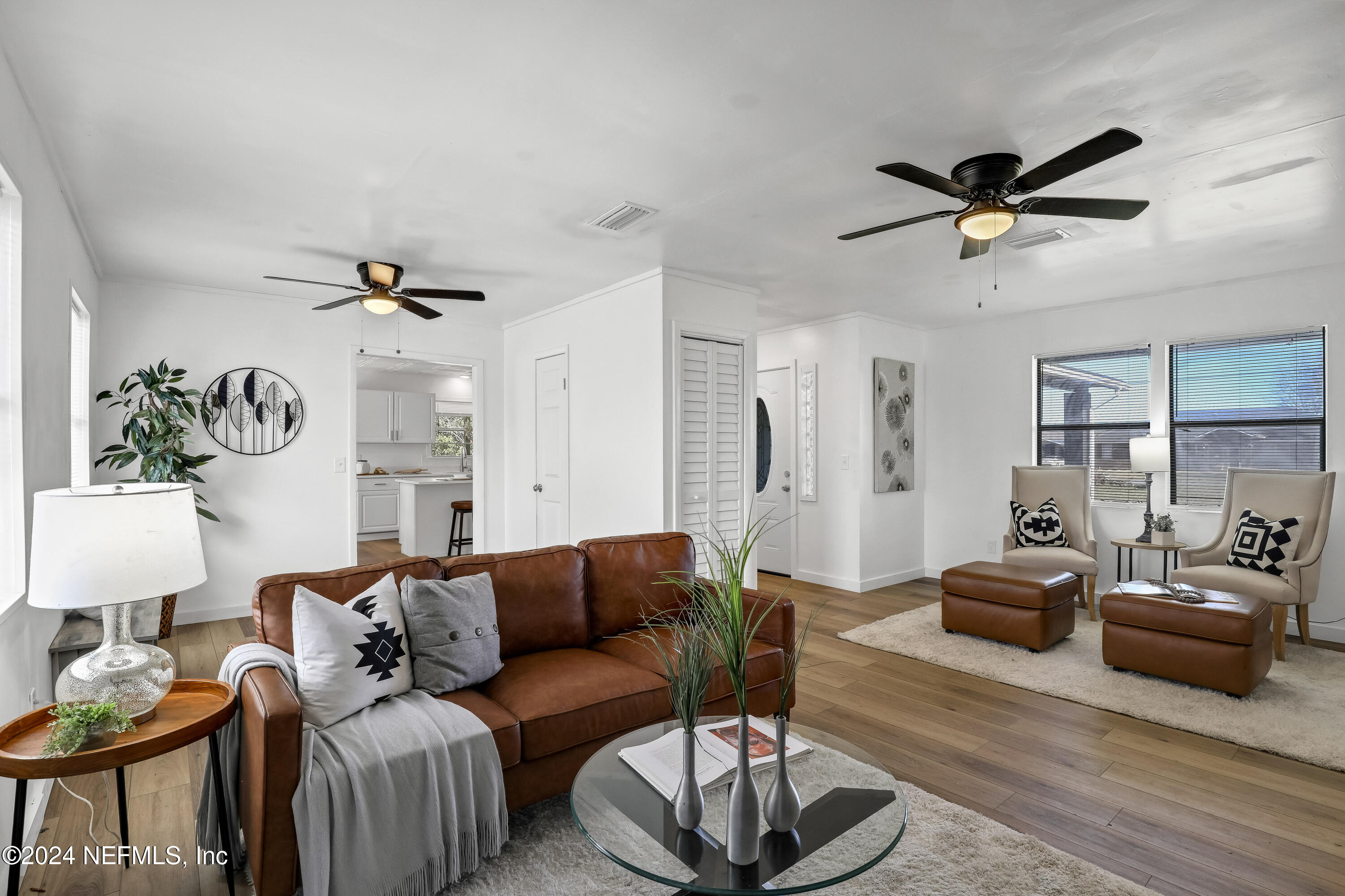 54221 Cravey Road Callahan, FL 32011 - Photo 17 of 52 a living room with furniture a ceiling fan and a rug
