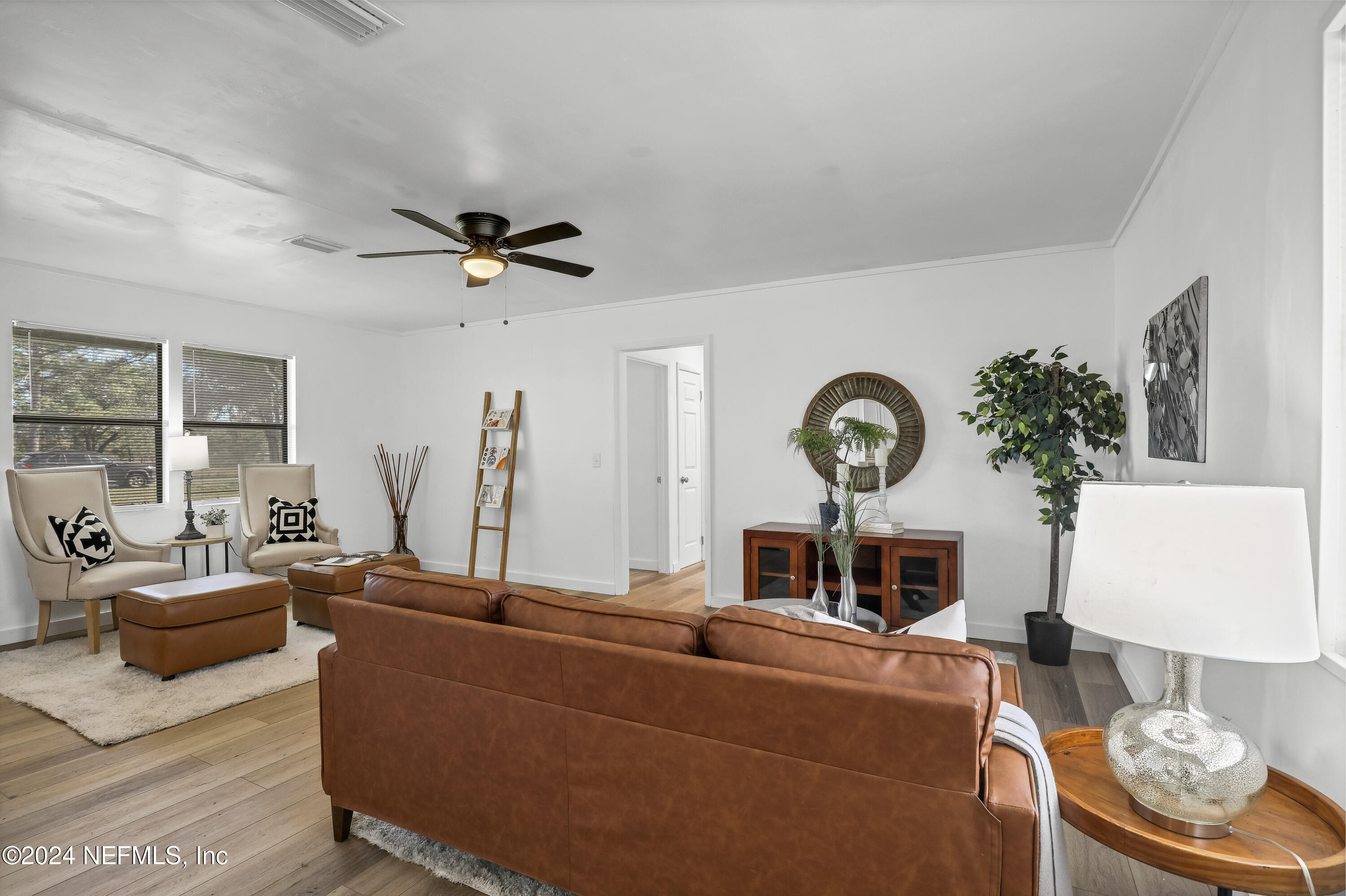 54221 Cravey Road Callahan, FL 32011 - Photo 18 of 52 a living room with furniture a window and a table