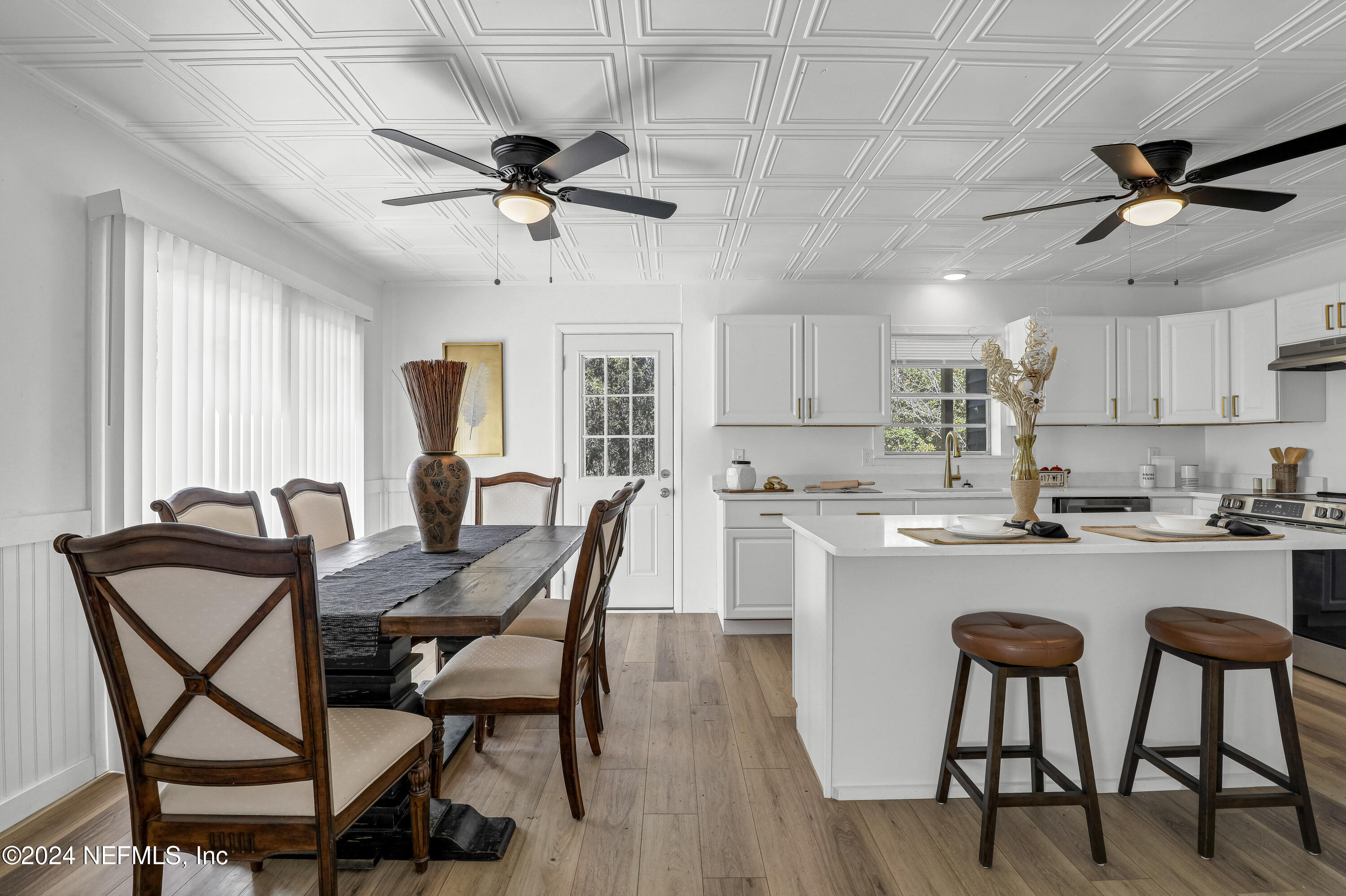 54221 Cravey Road Callahan, FL 32011 - Photo 20 of 52 a view of a dining room with furniture and a chandelier