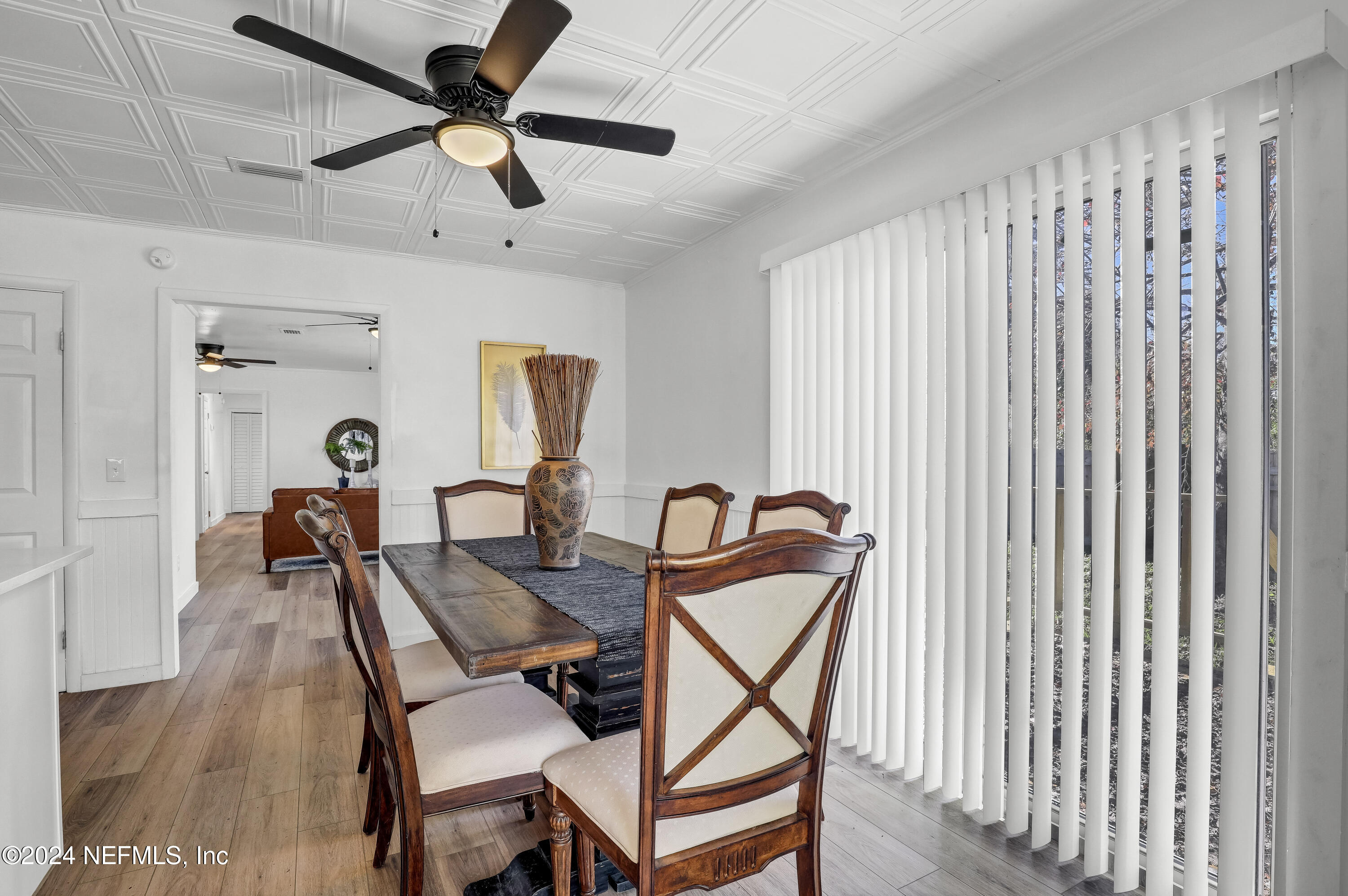 54221 Cravey Road Callahan, FL 32011 - Photo 22 of 52 a dining room with furniture and a chandelier