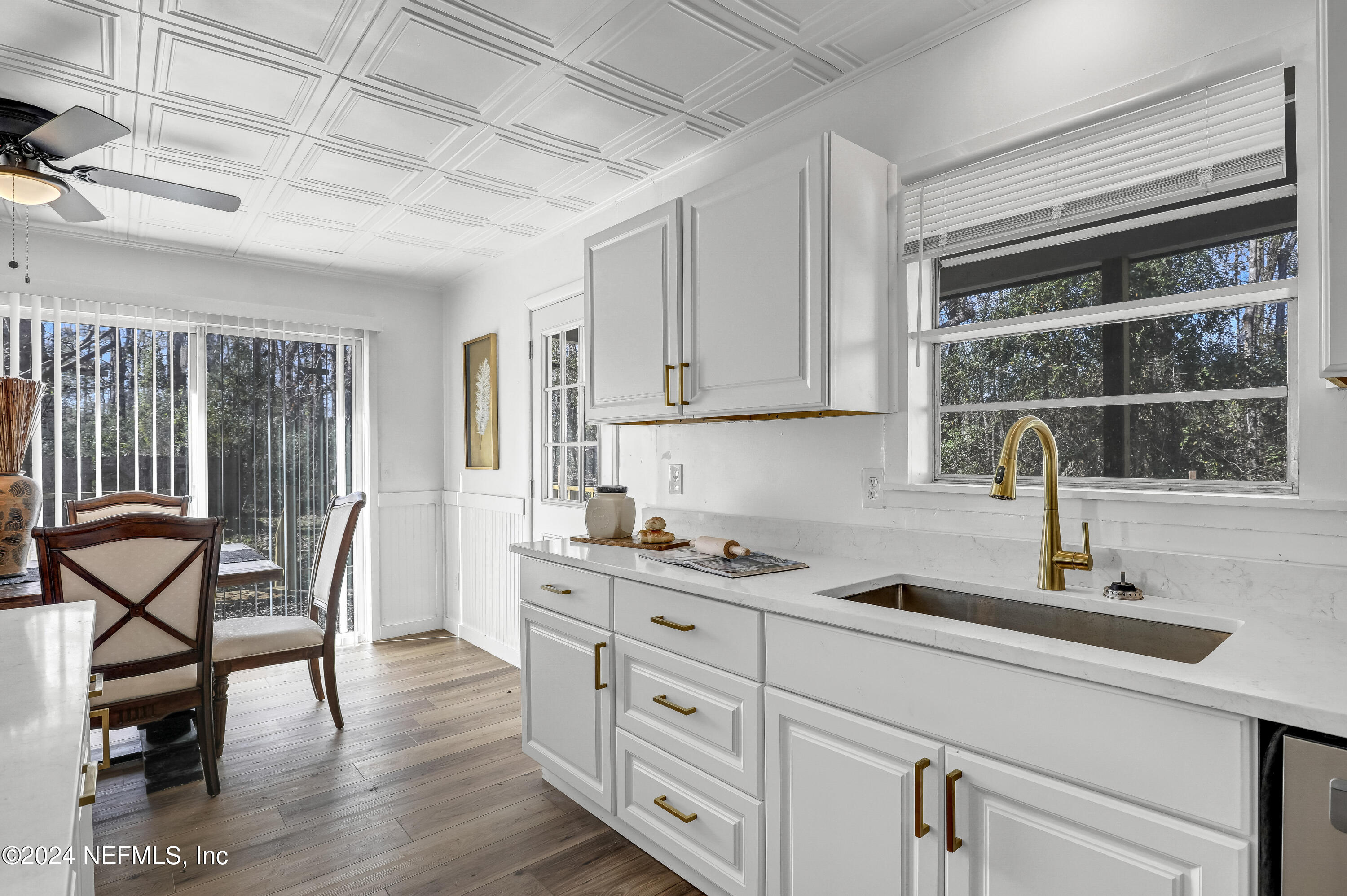 54221 Cravey Road Callahan, FL 32011 - Photo 26 of 52 a kitchen with stainless steel appliances granite countertop a stove and a sink