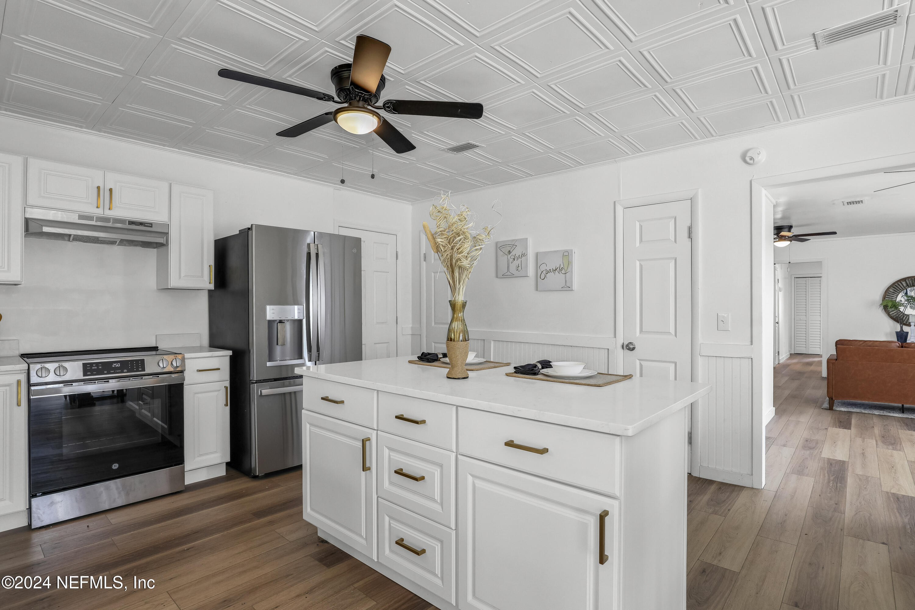 54221 Cravey Road Callahan, FL 32011 - Photo 28 of 52 a kitchen with a sink stove and refrigerator