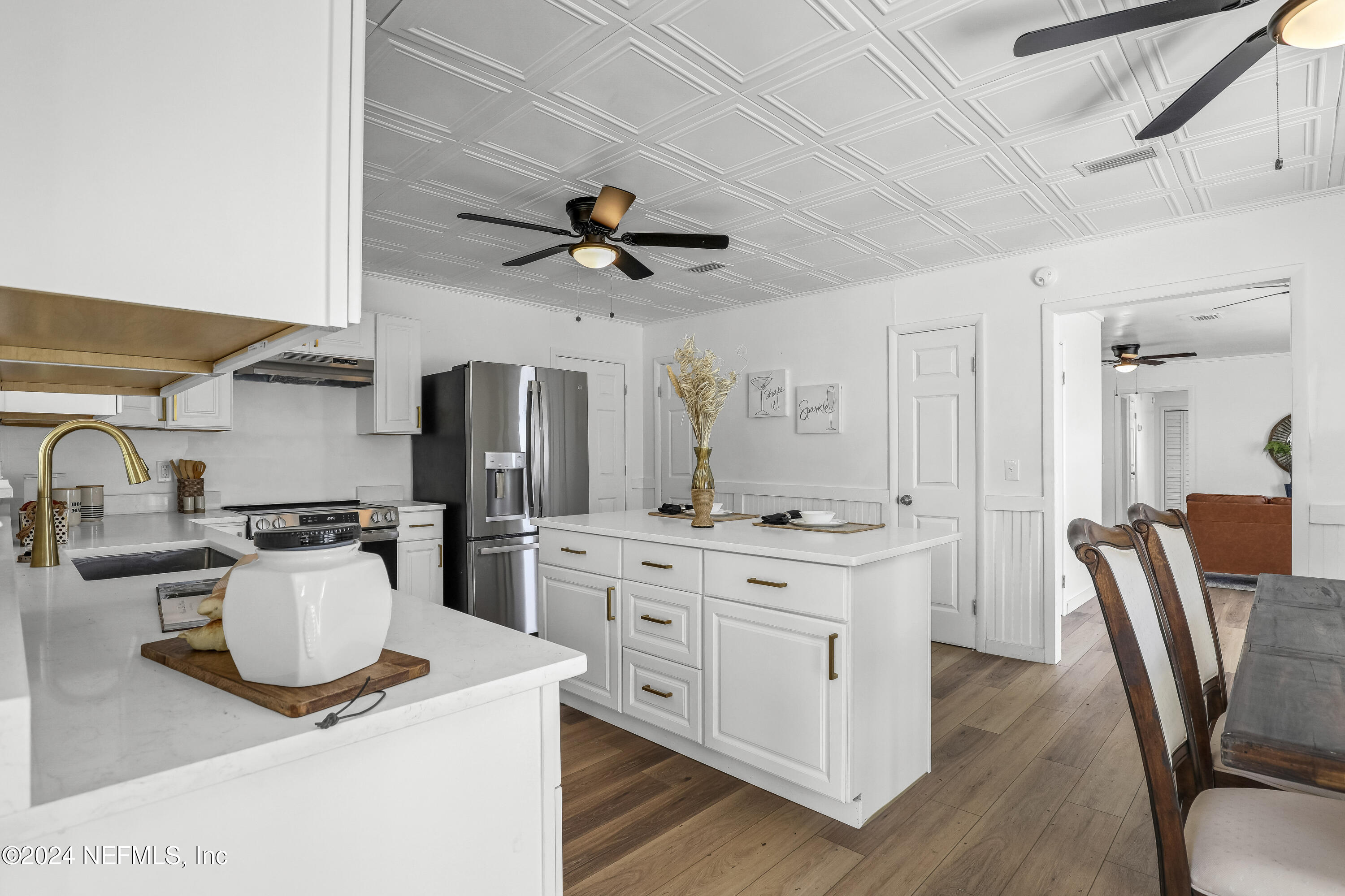 54221 Cravey Road Callahan, FL 32011 - Photo 29 of 52 a kitchen with stainless steel appliances granite countertop a stove and a refrigerator