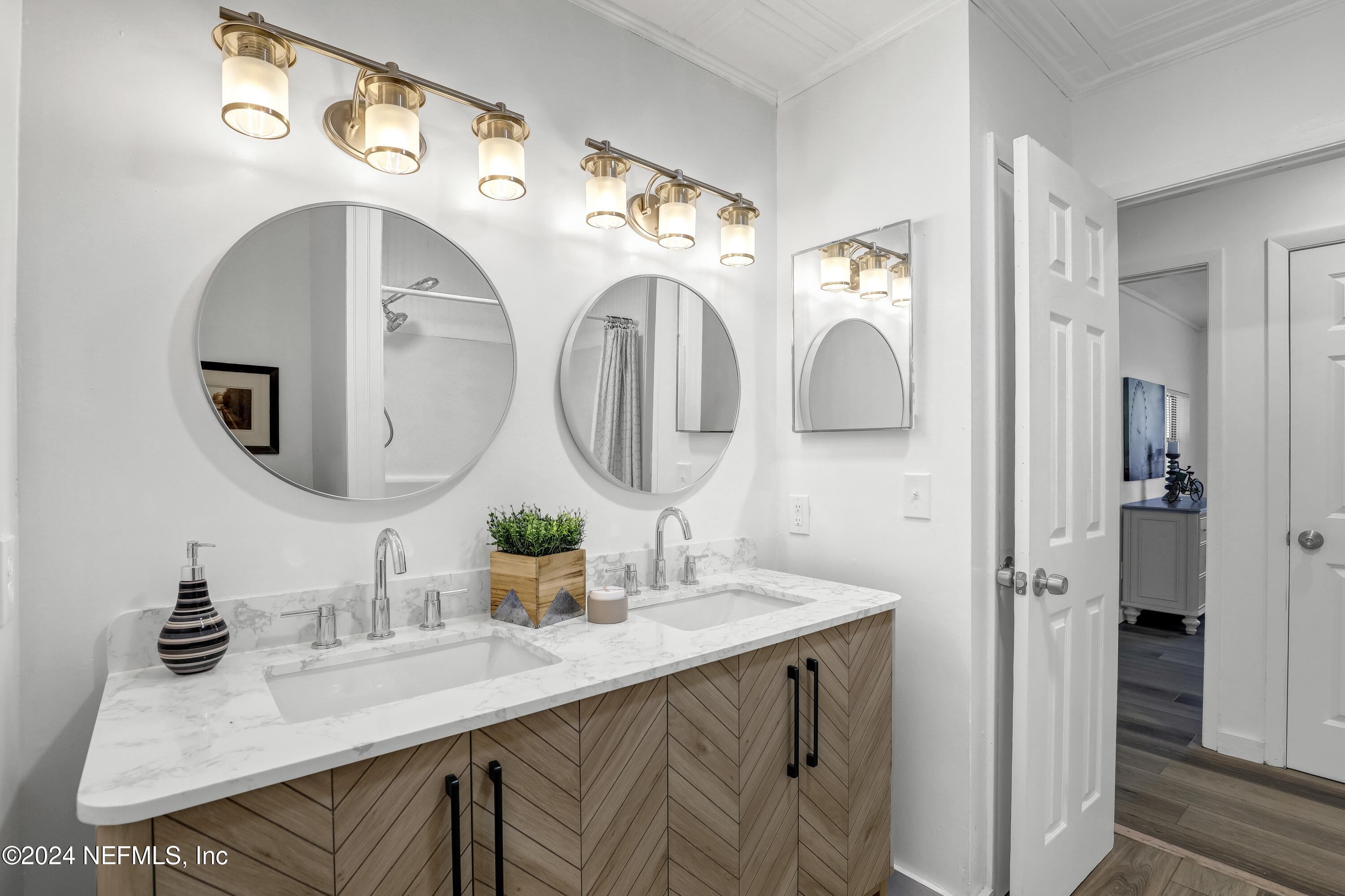 54221 Cravey Road Callahan, FL 32011 - Photo 33 of 52 a bathroom with a sink and a mirror