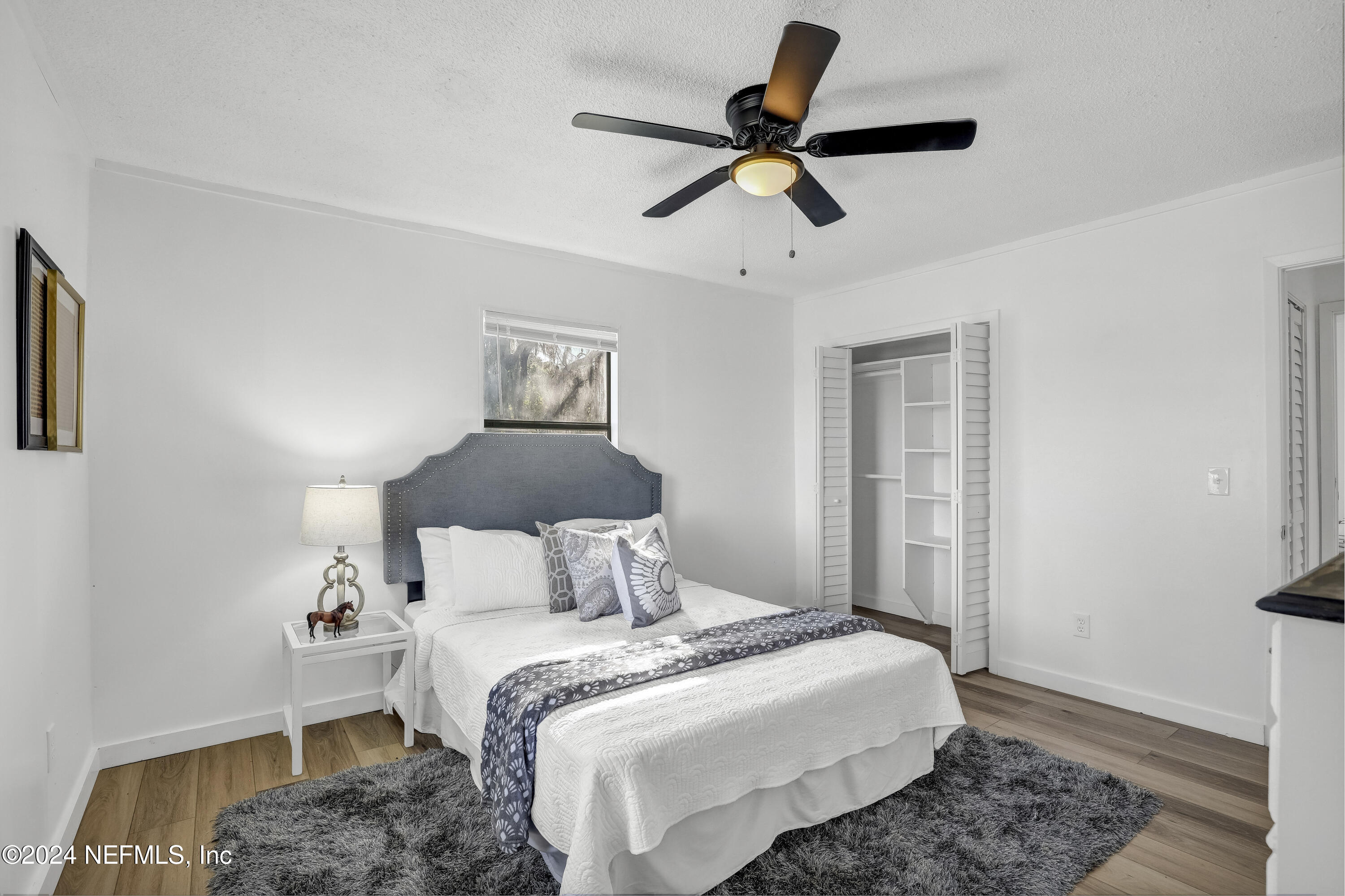 54221 Cravey Road Callahan, FL 32011 - Photo 37 of 52 a bedroom with a bed and a window