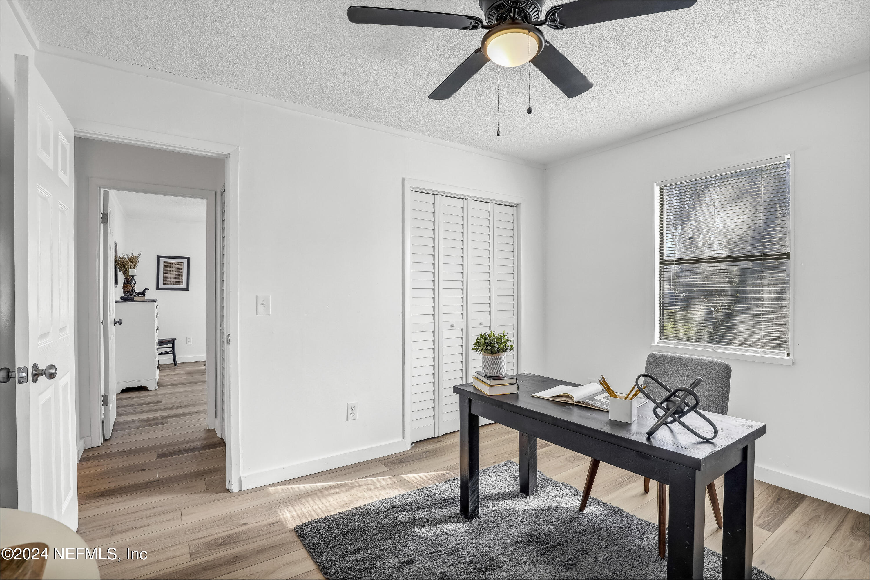 54221 Cravey Road Callahan, FL 32011 - Photo 39 of 52 a view of a workspace with furniture and a window