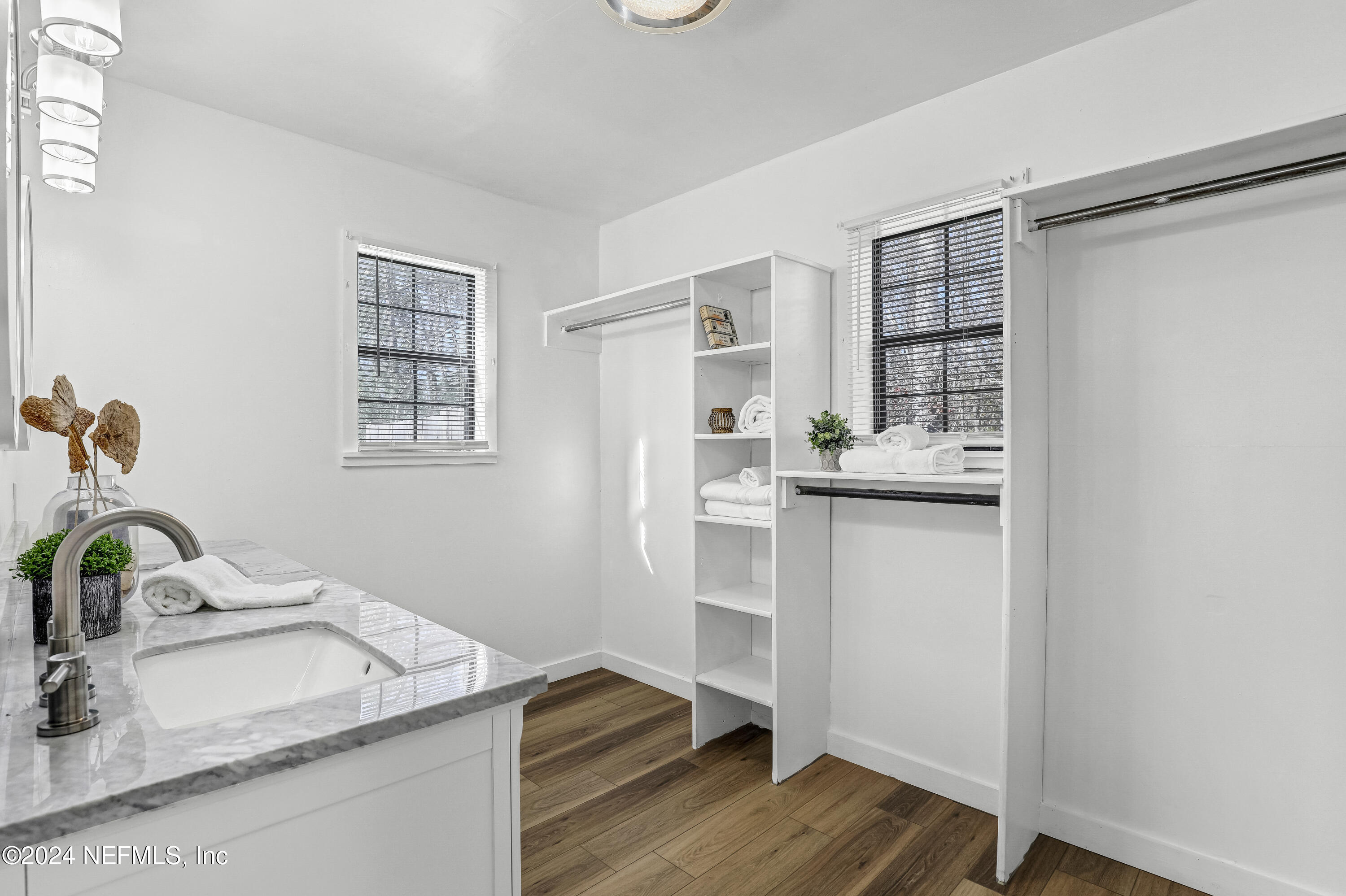 54221 Cravey Road Callahan, FL 32011 - Photo 43 of 52 a kitchen with a sink cabinets and wooden floor