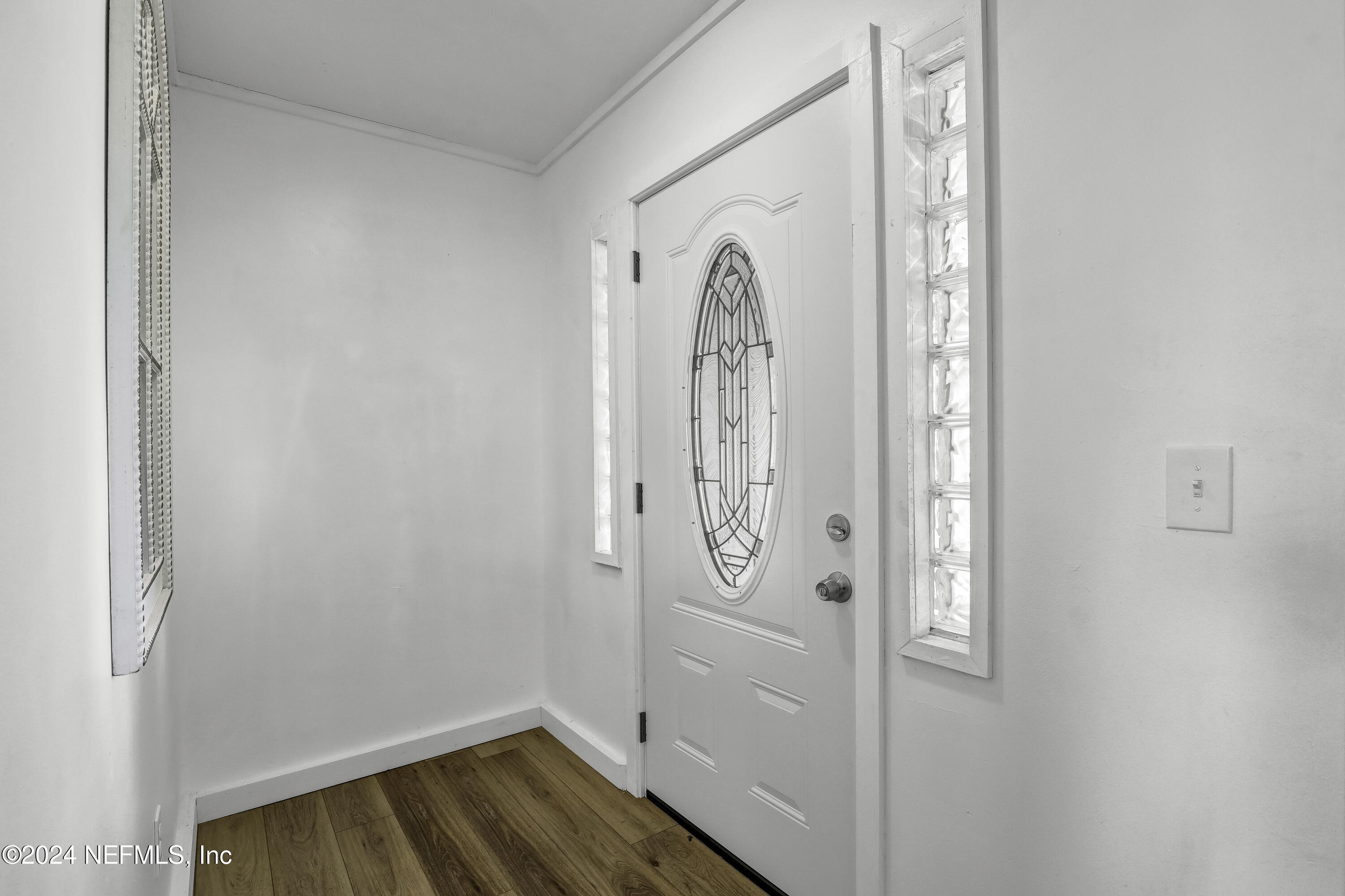54221 Cravey Road Callahan, FL 32011 - Photo 10 of 52 a view of a room with wooden floor