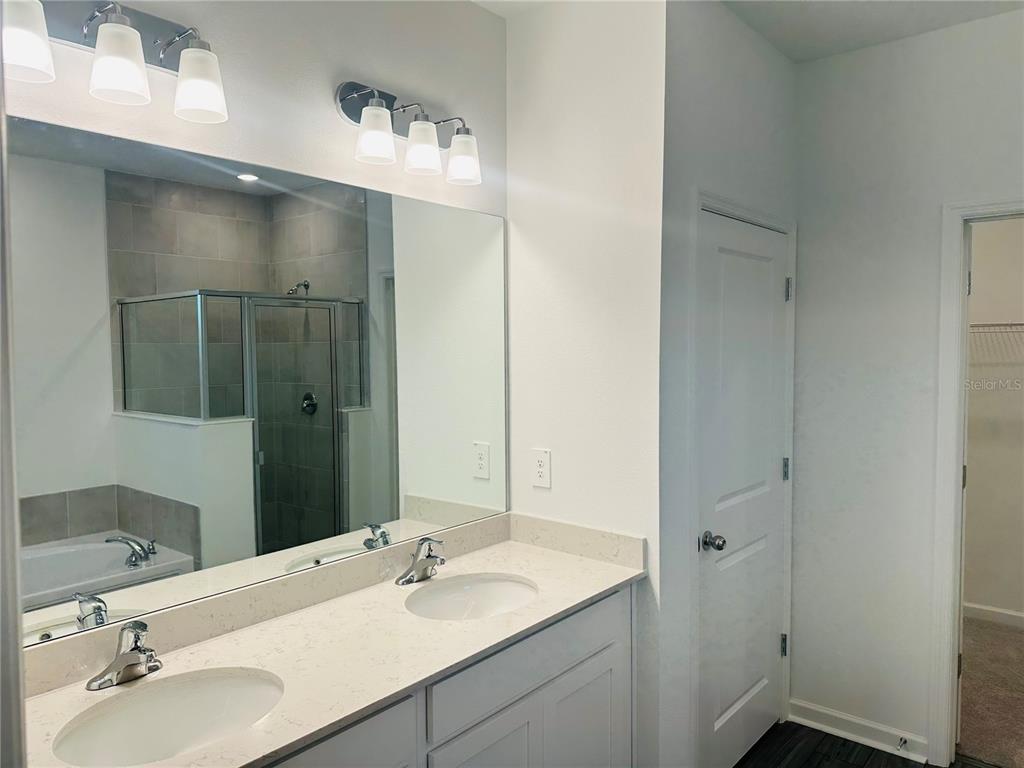 1139 Northwest 44th Court Road Ocala, FL 34482 - Photo 18 of 36 a bathroom with a sink and a mirror