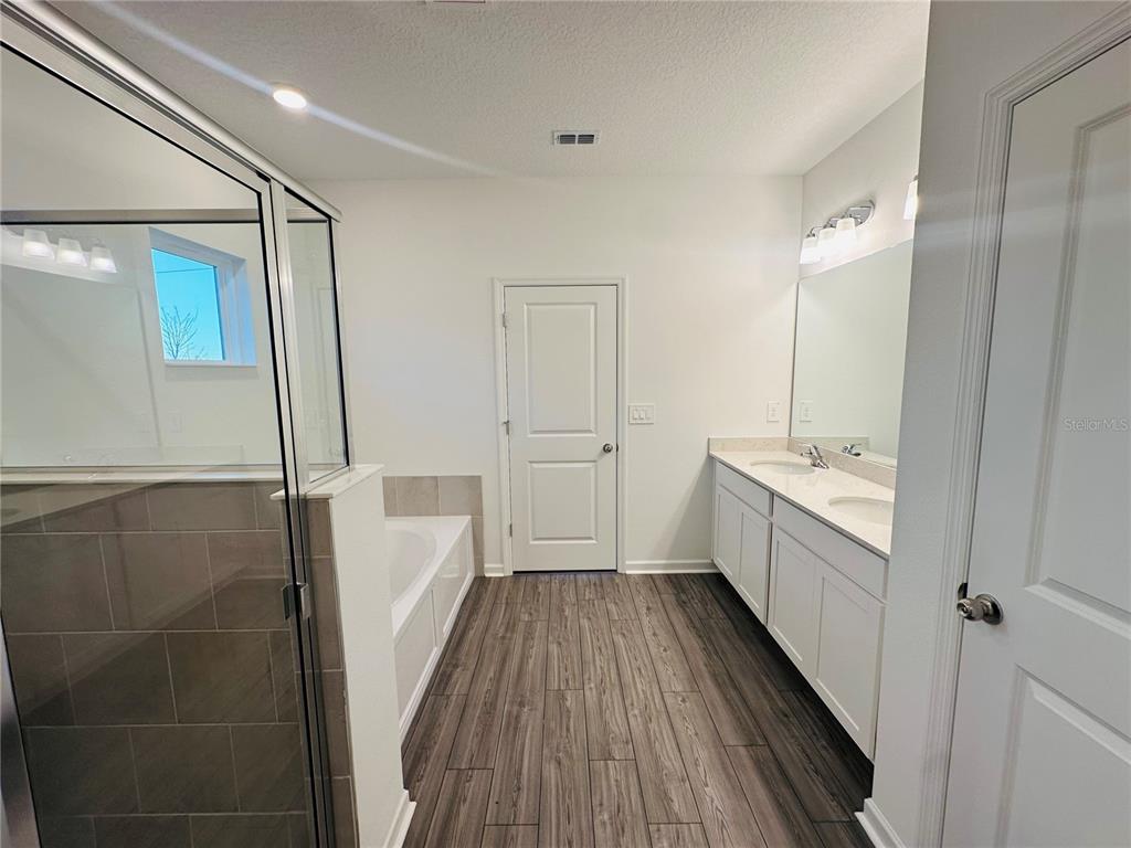 1139 Northwest 44th Court Road Ocala, FL 34482 - Photo 20 of 36 a bathroom with a sink a toilet and shower