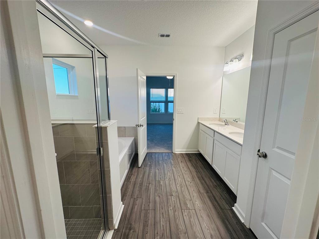 1139 Northwest 44th Court Road Ocala, FL 34482 - Photo 22 of 36 a bathroom with a bathtub and a sink