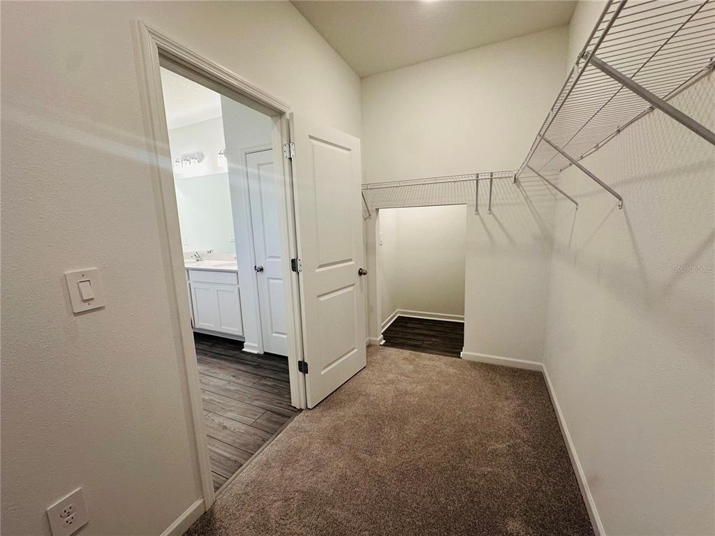 1139 Northwest 44th Court Road Ocala, FL 34482 - Photo 23 of 36 an empty room with white cabinet and mirrors