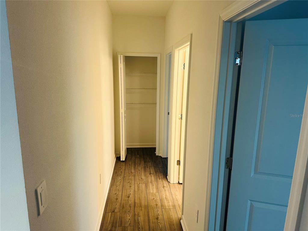 1139 Northwest 44th Court Road Ocala, FL 34482 - Photo 26 of 36 a view of a hallway with wooden floor