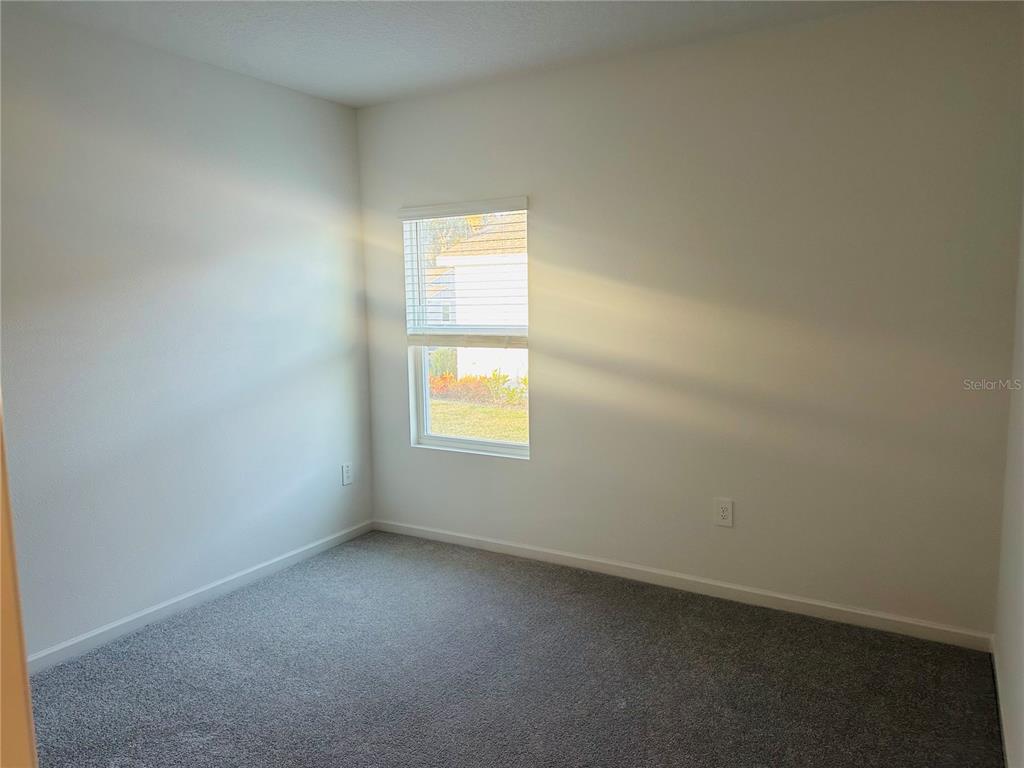 1139 Northwest 44th Court Road Ocala, FL 34482 - Photo 27 of 36 an empty room with a window