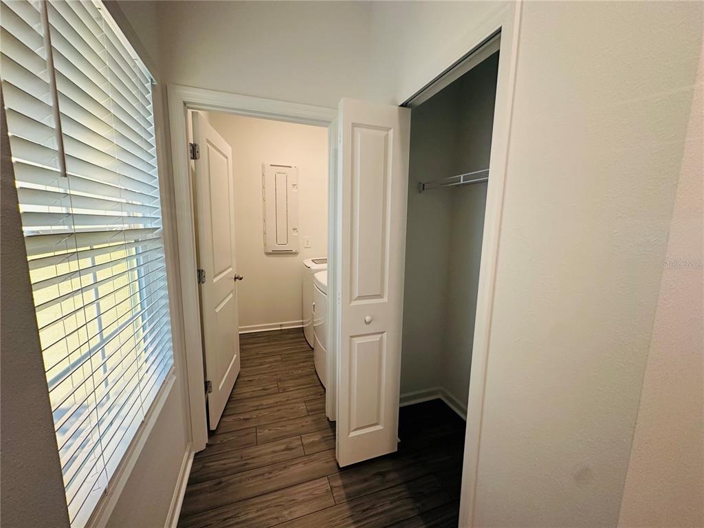 1139 Northwest 44th Court Road Ocala, FL 34482 - Photo 33 of 36 a view of a hallway with wooden floor and staircase