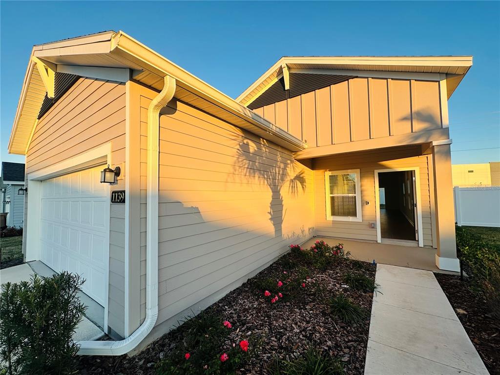 1139 Northwest 44th Court Road Ocala, FL 34482 - Photo 4 of 36 a view of a house with backyard and sitting area