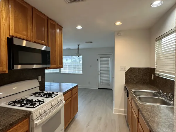 a kitchen with a stove and a microwave