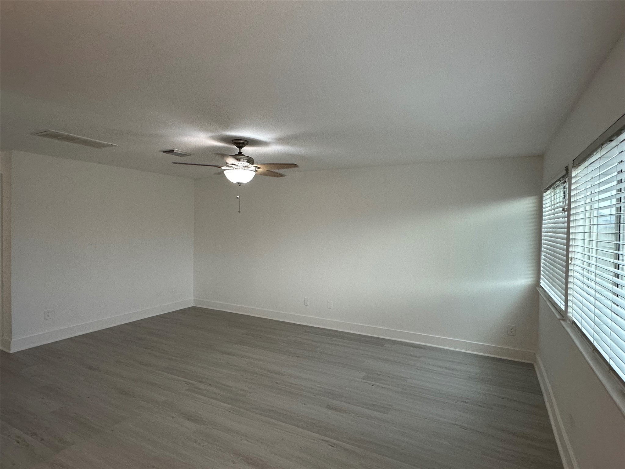 7430 Rabbit Ridge Missouri City, TX 77459 - Photo 8 of 17 wooden floor in an empty room