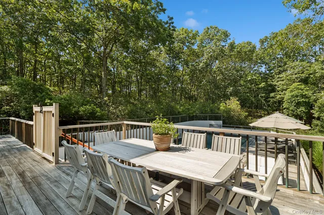 a view of a table and chairs on the roof deck