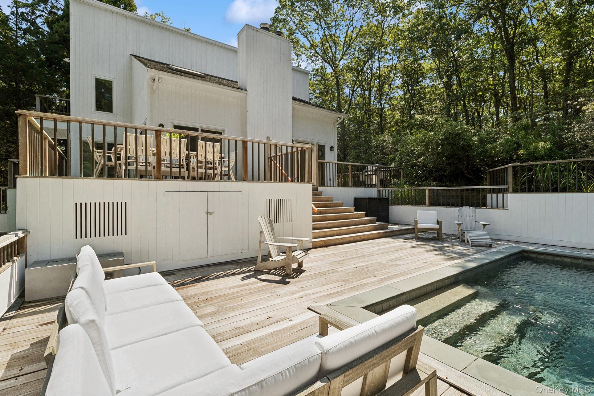28 Ridge Road Wainscott, NY 11937 - Photo 17 of 40 a view of balcony with wooden floor and seating space