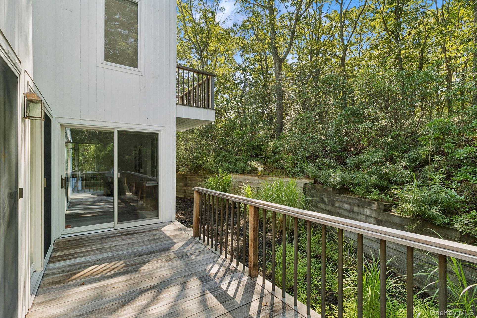 28 Ridge Road Wainscott, NY 11937 - Photo 18 of 40 a view of a balcony with wooden floor