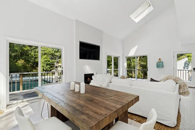 a dining room with table and chairs