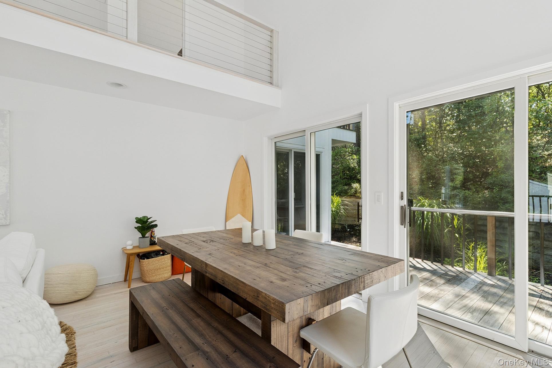 28 Ridge Road Wainscott, NY 11937 - Photo 25 of 40 a view of a dining room with furniture window and outside view