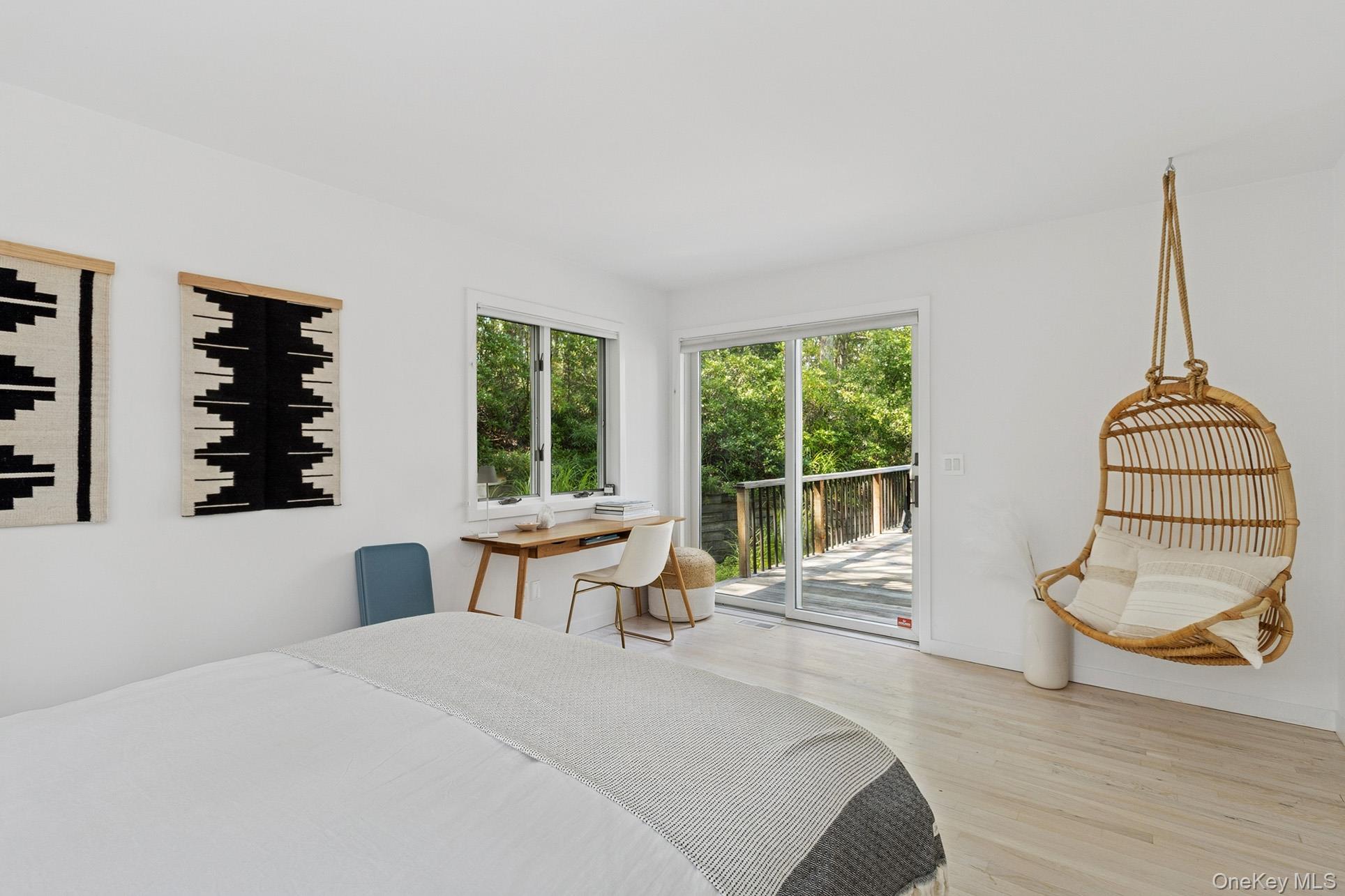 28 Ridge Road Wainscott, NY 11937 - Photo 34 of 40 a bedroom with furniture and a large window