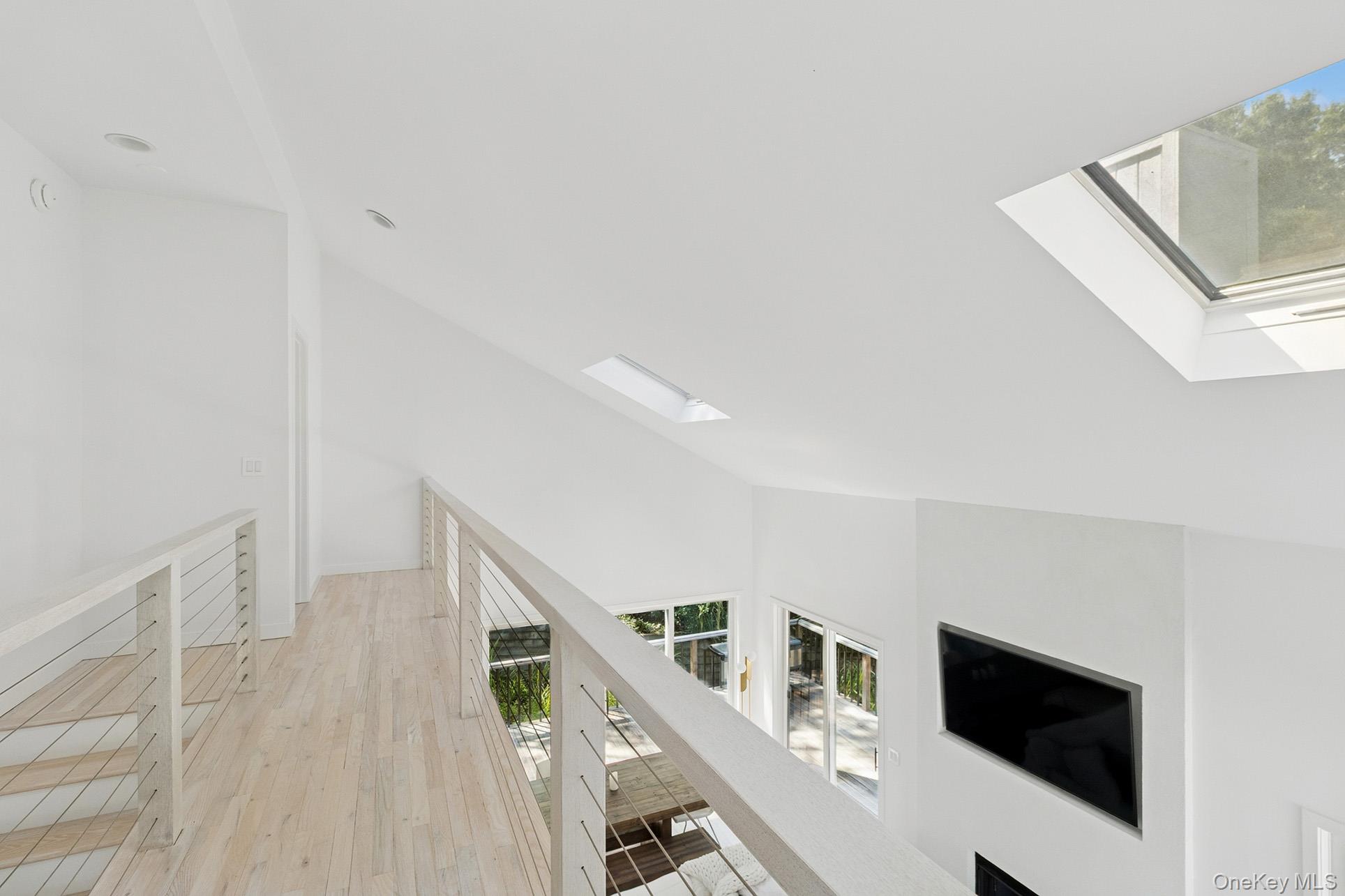 28 Ridge Road Wainscott, NY 11937 - Photo 36 of 40 a view of entryway and hall with wooden floor